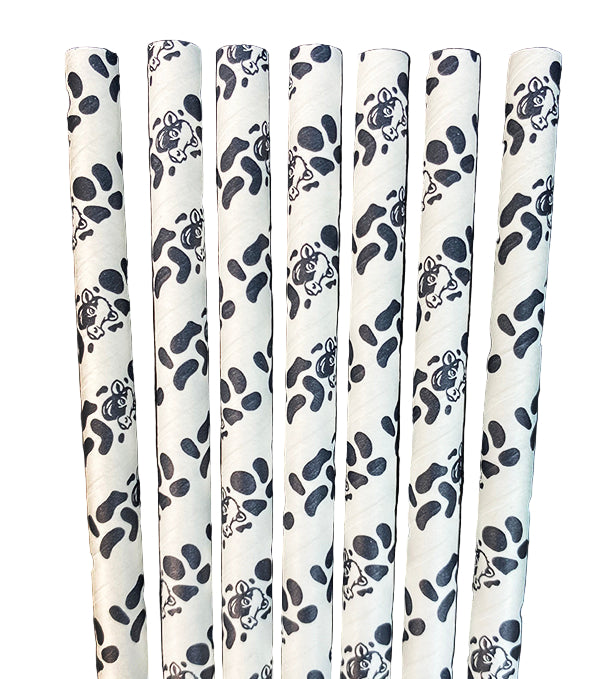 Set of white straws with black paw print pattern on a white background