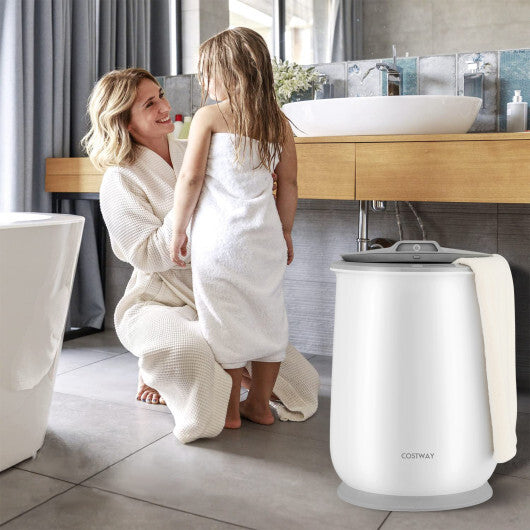 Woman and child in a bathroom with a white appliance labeled 'Cossway'.