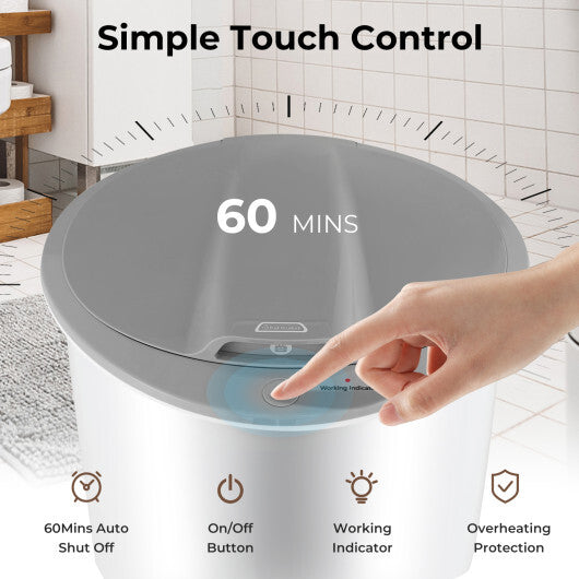 Hand pressing a button on a gray electronic device with '60 MINS' display, set against a bathroom background.