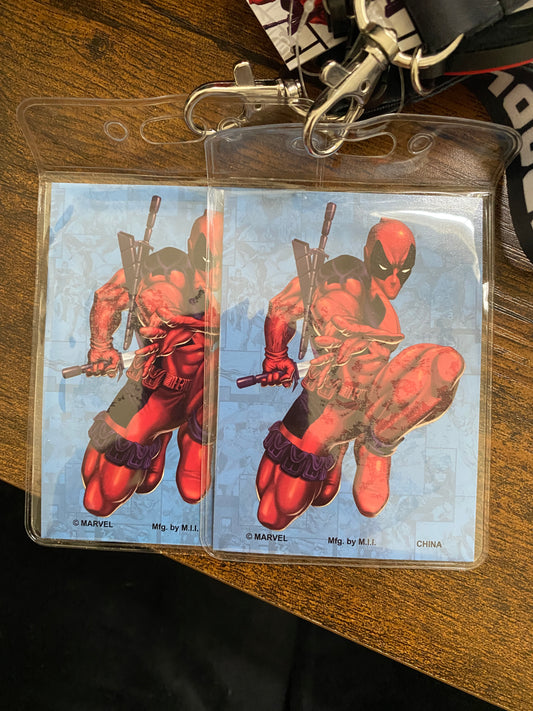 Deadpool trading card in a clear holder on a wooden surface